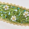 A simple and elegant hair accessory with a white floral hairpin and green crystal accents Application Scenario